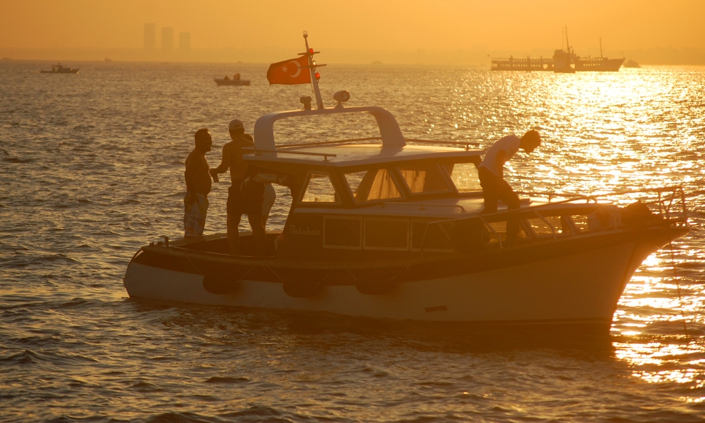 Boat on Bosphorous Strait in Istanbul at Sunset