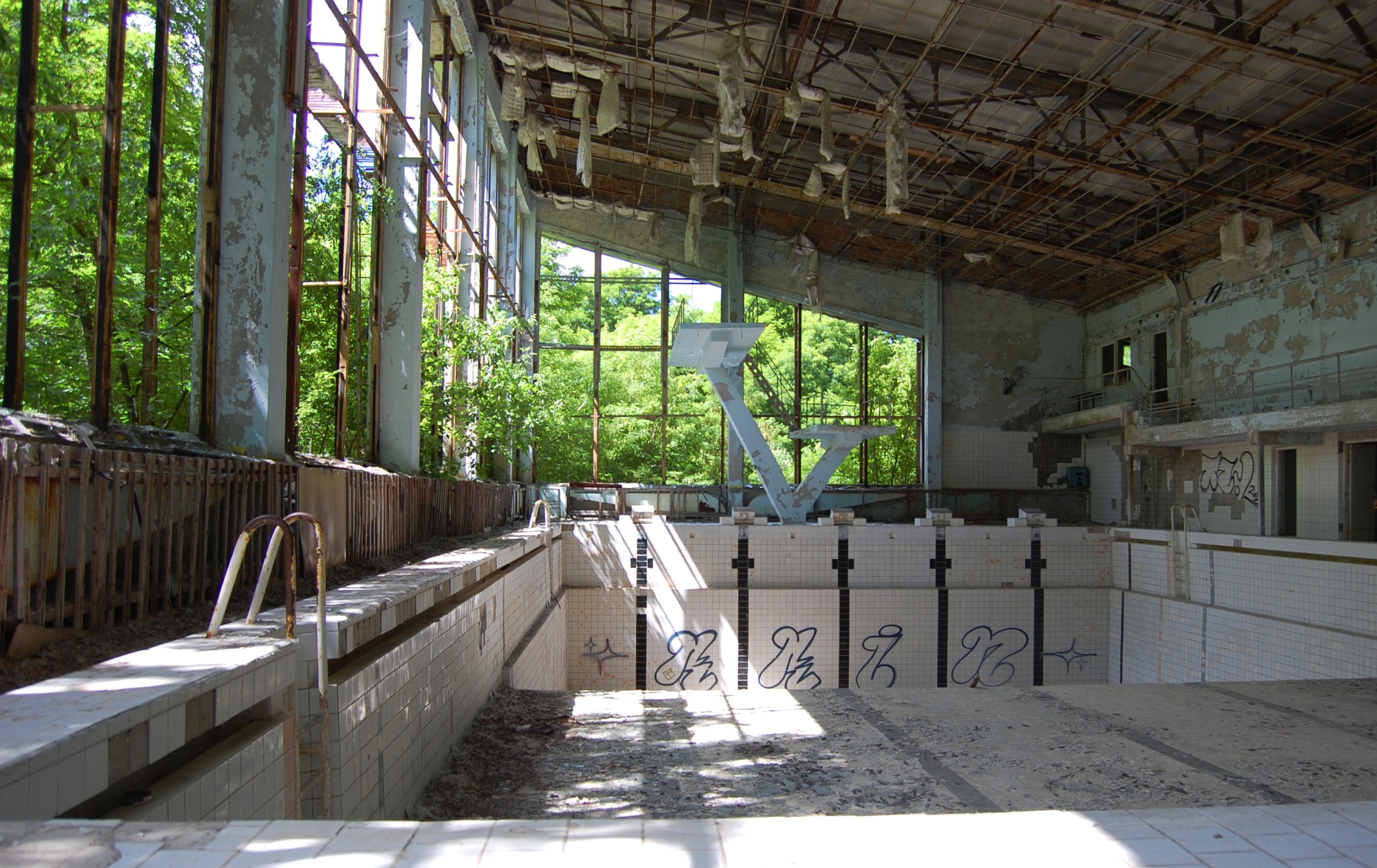Visiting Chernobyl, depending on your guide, will let you explore a lot of the abandoned buildings of the town of including this swimming pool.